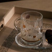 دملاج طقم حياة المؤلف من 4 أكواب مع صحونها باللون الذهبي